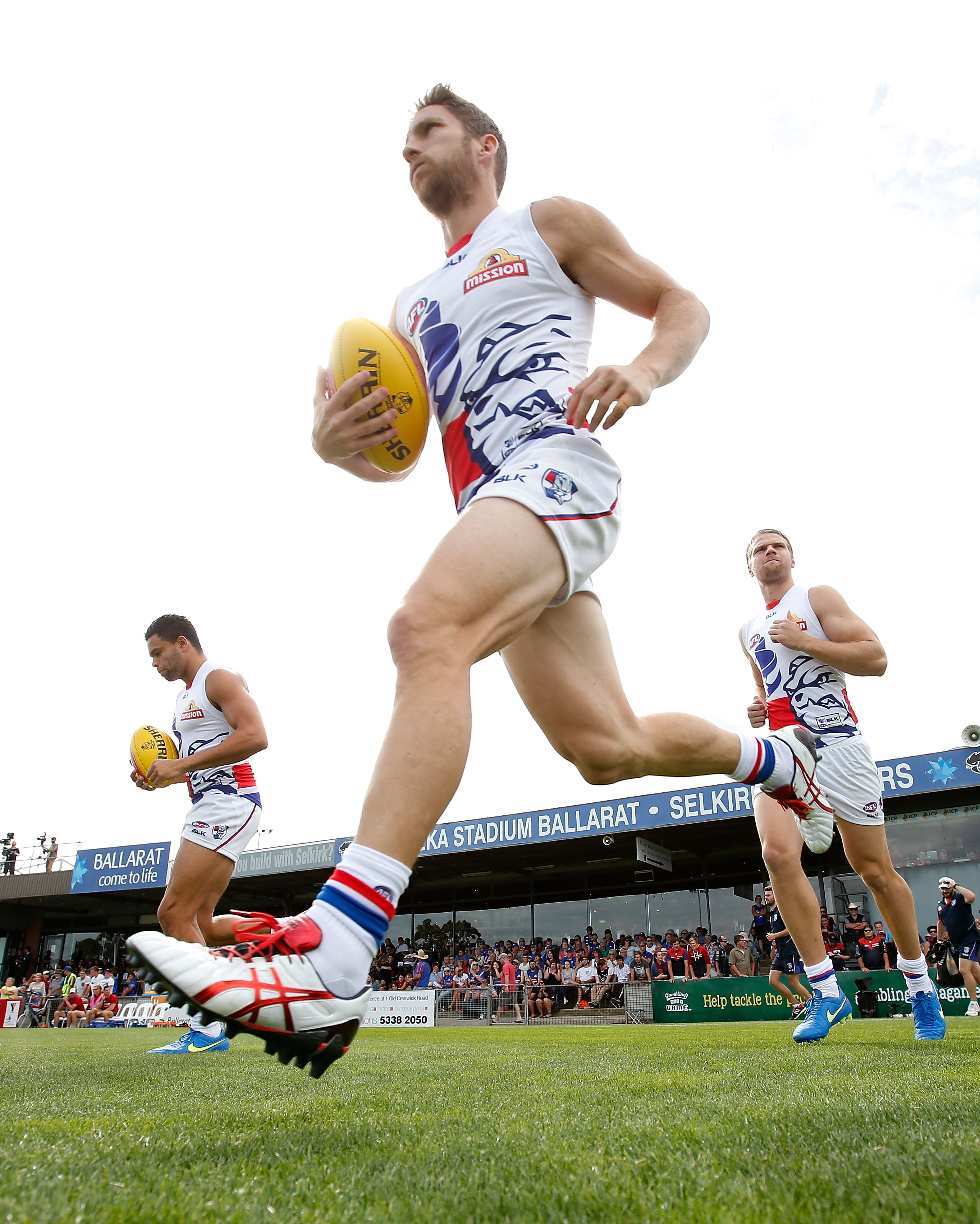 AFL 2015 NAB Challenge - Western Bulldogs v Melbourne Matthew Boyd of the Bulldogs runs onto the field during the 2015 NAB Challenge Week 3 match between the Western Bulldogs and the Melbourne Demons at Eureka Stadium, Ballarat on March 14, 2015. (Photo: Michael Willson/AFL Media)